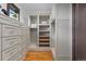 Organized walk-in closet with custom shelves, drawers, and ample storage space at 11790 Huckleberry Dr, Franktown, CO 80116