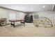 Spacious finished basement featuring a carpeted floor and recreational equipment at 17056 E 111Th Ave, Commerce City, CO 80022