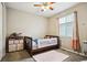 Quaint bedroom features a window and neutral colors with a toddler bed and dresser at 17056 E 111Th Ave, Commerce City, CO 80022