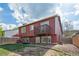 Two story home featuring a balcony, a patio and a well maintained backyard at 7598 Jared Way, Littleton, CO 80125