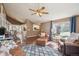 Cozy living room with leather sofas, a patterned rug, and staircase access to the upper level at 7598 Jared Way, Littleton, CO 80125