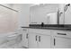 Bright bathroom with a shower-tub combo, undermount sink in a vanity and stylish fixtures at 213 Washington St, Erie, CO 80516