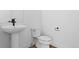 Bathroom with white pedestal sink at 213 Washington St, Erie, CO 80516