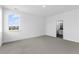 Bedroom featuring carpeted floors and an adjoining bathroom at 213 Washington St, Erie, CO 80516
