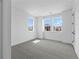 Bright bedroom with three large windows offering natural light and community views at 213 Washington St, Erie, CO 80516