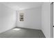 Clean bedroom with neutral walls and carpet, featuring a window that provides natural light at 213 Washington St, Erie, CO 80516