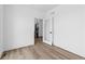 Bright hallway featuring hardwood floors, a glass door, and access to a staircase at 213 Washington St, Erie, CO 80516