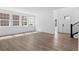 Spacious living room featuring hardwood floors and large windows at 213 Washington St, Erie, CO 80516