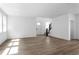 Inviting living room with hardwood floors, a modern staircase, and a bright, open layout at 213 Washington St, Erie, CO 80516