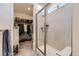 Shower with a view into walk-in closet at 15919 Xanthia Way, Thornton, CO 80602
