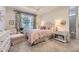 Comfortable bedroom with natural light, soft carpet, and stylish curtains at 15919 Xanthia Way, Thornton, CO 80602