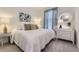 Comfortable bedroom with carpeting, lamps, pillows, and dresser at 15919 Xanthia Way, Thornton, CO 80602