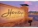 Monument sign for Heritage Golf Club, featuring stone base and accent lighting at 15919 Xanthia Way, Thornton, CO 80602