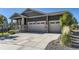 Beautiful home featuring a three car garage and a well-maintained concrete driveway on a sunny day at 15919 Xanthia Way, Thornton, CO 80602