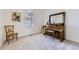 Cozy living room with a piano, chair and an attractive picture, lit by natural light at 15919 Xanthia Way, Thornton, CO 80602