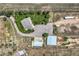 Aerial view of a house on a large lot with a barn, garage, and plenty of space for parking and activities at 50950 E 32Nd Ave, Bennett, CO 80102