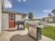 Outdoor view of home with grills and other buildings in the background at 50950 E 32Nd Ave, Bennett, CO 80102