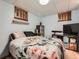 Bedroom with a large bed and floral blanket at 50950 E 32Nd Ave, Bennett, CO 80102