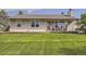 Charming home with a wooden porch and well-manicured front lawn at 50950 E 32Nd Ave, Bennett, CO 80102