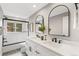 Bright bathroom featuring double vanity sinks, walk-in shower and matte black hardware at 7743 S Birch Ct, Centennial, CO 80122