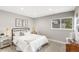 Cozy bedroom with neutral decor, a window and hardwood floors at 7743 S Birch Ct, Centennial, CO 80122