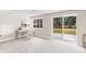 Bonus room with carpet and sliding glass door with access to the backyard at 7743 S Birch Ct, Centennial, CO 80122