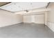 Spacious two car garage featuring newly epoxied floor and automatic door opener at 7743 S Birch Ct, Centennial, CO 80122