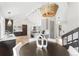 Dining area and kitchen featuring a light fixture and modern cabinets at 7743 S Birch Ct, Centennial, CO 80122