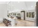 Bright, modern kitchen featuring an island with seating, stainless steel appliances, and large windows at 7743 S Birch Ct, Centennial, CO 80122