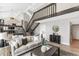 Comfortable living room with stairs leading to a second story and stylish interior design at 7743 S Birch Ct, Centennial, CO 80122