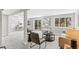Open concept living room with outdoor access and neutral decor at 7743 S Birch Ct, Centennial, CO 80122