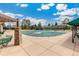 Community pool covered for the off-season, showcasing a large patio and seating area at 7743 S Birch Ct, Centennial, CO 80122