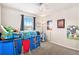 Cozy ' bedroom with carpeting, ample natural light, and playful decor at 26903 E Easter Pl, Aurora, CO 80016
