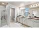 Well-lit bathroom with double sinks, and a separate shower, perfect for a relaxing routine at 26903 E Easter Pl, Aurora, CO 80016