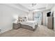 Calming main bedroom offering soft neutral colors, tray ceiling, and generous natural light at 26903 E Easter Pl, Aurora, CO 80016