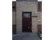 The brick home features a secure front door with a metal security grate and the house number 1564 at 1564 Verbena St, Denver, CO 80220