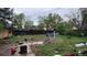Spacious backyard surrounded by mature trees and fencing, offering privacy and room for outdoor activities at 1653 Trenton St, Denver, CO 80220