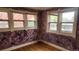 Inviting bedroom featuring hardwood floors and multiple windows that bring in lots of natural light at 1653 Trenton St, Denver, CO 80220