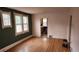 Bright living room with hardwood floors, large windows, and neutral paint, perfect for relaxation at 1653 Trenton St, Denver, CO 80220