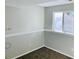 Finished basement room with neutral walls, carpet, and a window at 18971 E Mercer Dr, Aurora, CO 80013