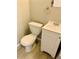 Small bathroom with toilet, sink, and a pedestal sink at 18971 E Mercer Dr, Aurora, CO 80013