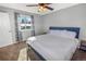 Comfortable bedroom featuring neutral walls, carpet, ceiling fan, and ample natural light at 18971 E Mercer Dr, Aurora, CO 80013