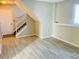 Living room with tile floor and access to the stairs at 18971 E Mercer Dr, Aurora, CO 80013