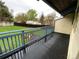 Blue deck overlooking the backyard, showcasing a green lawn and surrounding greenery at 865 S Depew St, Lakewood, CO 80226