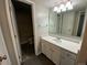 Comfortable bathroom with ample cabinet space and well-lit vanity at 865 S Depew St, Lakewood, CO 80226