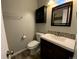 Elegant bathroom featuring modern vanity and decorative mirror at 865 S Depew St, Lakewood, CO 80226