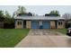Charming brick home featuring attached garages and well-maintained front yard at 865 S Depew St, Lakewood, CO 80226
