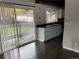Modern kitchen features sleek countertops, and sliding door access to the backyard at 865 S Depew St, Lakewood, CO 80226