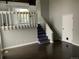 Inviting living space with staircase, hardwood floors, and natural light at 865 S Depew St, Lakewood, CO 80226