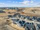 An aerial view shows a neighborhood under construction with modern homes and scenic surroundings at 3350 Backdrop Ct, Castle Rock, CO 80108